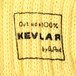 A close up of a yellow knitted fabric similar to a sweater.