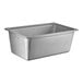 A Vollrath stainless steel transport pan with a lid on a counter.