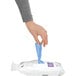 A person holding a blue simplehuman Liter Code H bag.