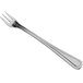 A silver cocktail fork with a long handle.
