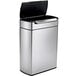 A silver trash can with a black lid.