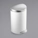 A white simplehuman semi-round step-on trash can with a silver lid.