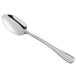 a silver spoon on a white background