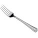 a silver fork on a white background