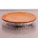 A pie in a D&W Fine Pack foil pie pan on a table.