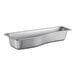 A Vollrath stainless steel pan with a curved design.