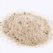 A white plate with a pile of Italian style seasoned bread crumbs on it.