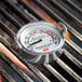 close-up of a thermometer on a grill