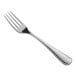 A close-up of a Oneida New Rim stainless steel dinner fork with a silver handle.