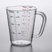 a measuring cup with red writing