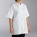 A woman wearing a white Uncommon Chef cook shirt.