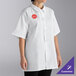 A woman wearing a white Uncommon Chef cook shirt.