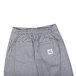 A pair of black and white checkered Chef Revival chef pants with a side pocket.