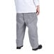 a person wearing a white shirt and gray pants