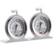 Two Cooper-Atkins hot holding thermometers on a counter.