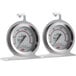 Two Cooper-Atkins dial oven thermometers on a white counter.