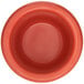 A close-up of a red Carlisle ramekin.