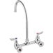A silver Waterloo wall mount faucet with two handles and two faucets.