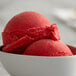 A close-up of a bowl of red I. Rice cherry water ice.