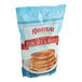 A bag of Krusteaz Professional Buttermilk Pancake & Waffle Mix on a white background.