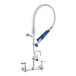 A silver and blue Waterloo low profile wall-mounted pre-rinse faucet with an add-on faucet and hose.