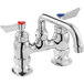 a silver faucet with a red and blue handle