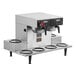 A Bunn commercial coffee brewer with six lower warmers on a counter.
