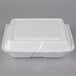 A white Dart foam hinged lid container.