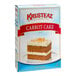 A white and blue box of Krusteaz Professional carrot cake mix.