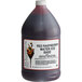 A close-up of a large I. Rice bottle of red raspberry water ice base.