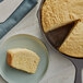 A slice of Southern-style cornbread in a pan with a brown crust.