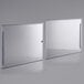 A white rectangular object with a pair of silver metal lids.