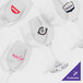 A group of Acopa customizable wine glasses with red logos on a white background.