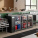 An Avantco back bar refrigerator with drinks on a shelf.