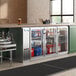 An Avantco back bar refrigerator with drinks and beverages in it.