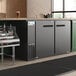 An Avantco black back bar refrigerator with two doors.