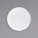 A bright white low round porcelain bowl with a white background.