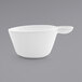 A white porcelain cup with a handle.