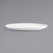 a white plate on a gray background