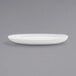 A white oval plate on a gray background.