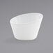 A Front of the House Harmony white porcelain slanted appetizer/fry cup.