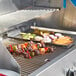 Crown Verity liquid propane grill with meat and vegetables cooking on it.