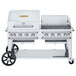 A large stainless steel Crown Verity outdoor grill on wheels.