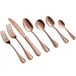 A close-up of a rose gold Acopa Vernon demitasse spoon.