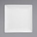A Front of the House bright white square porcelain plate.