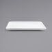 A Front of the House bright white square porcelain plate on a gray background.