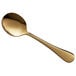 An Acopa Vernon gold stainless steel bouillon spoon with a long handle.