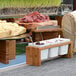 a row of white containers with food in them