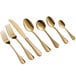 A close-up of a gold Acopa Vernon stainless steel dinner fork.