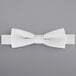 A white Henry Segal poly-satin bow tie with an adjustable band.